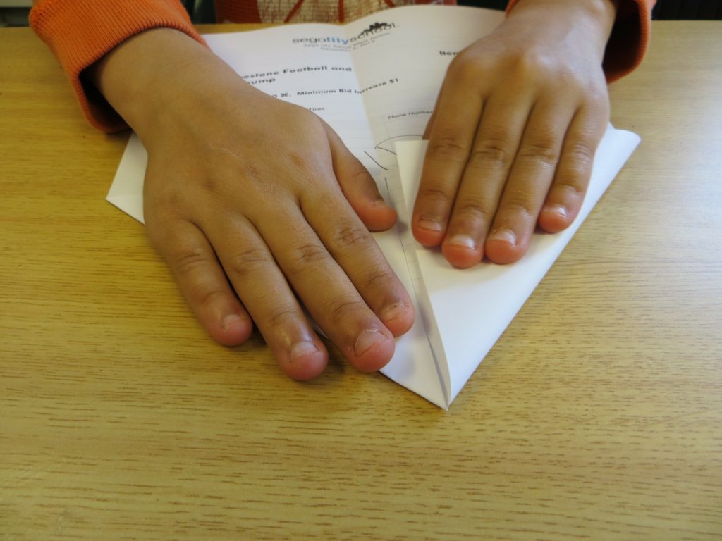 kids making paper planes