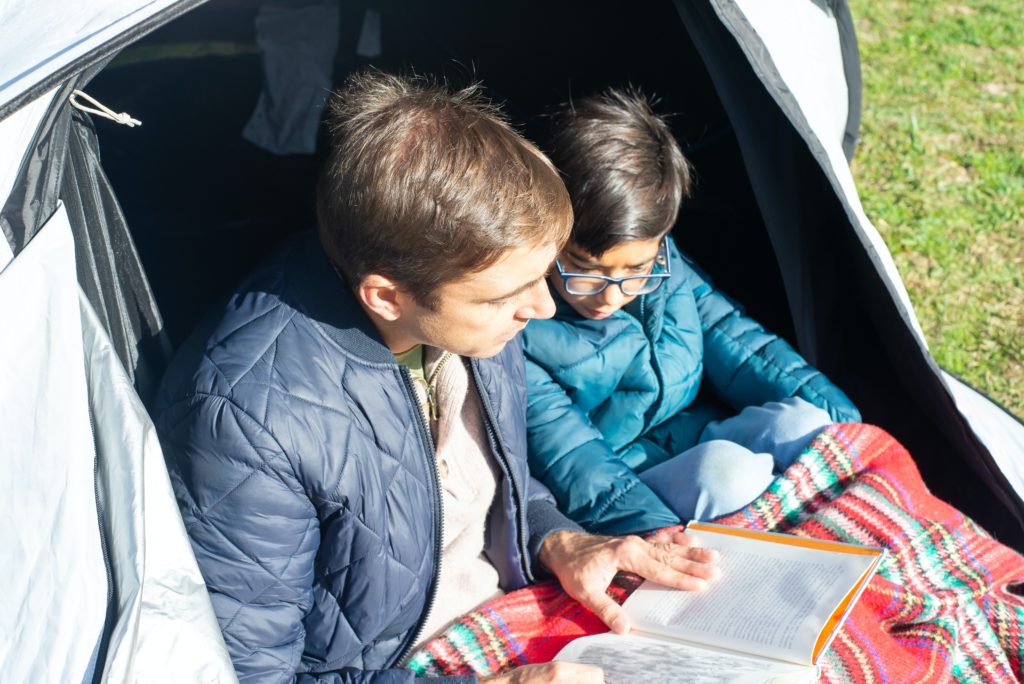 book reading during indoor camping