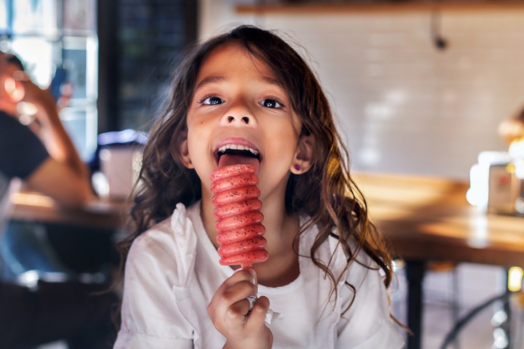 girl eating ice cream with dad